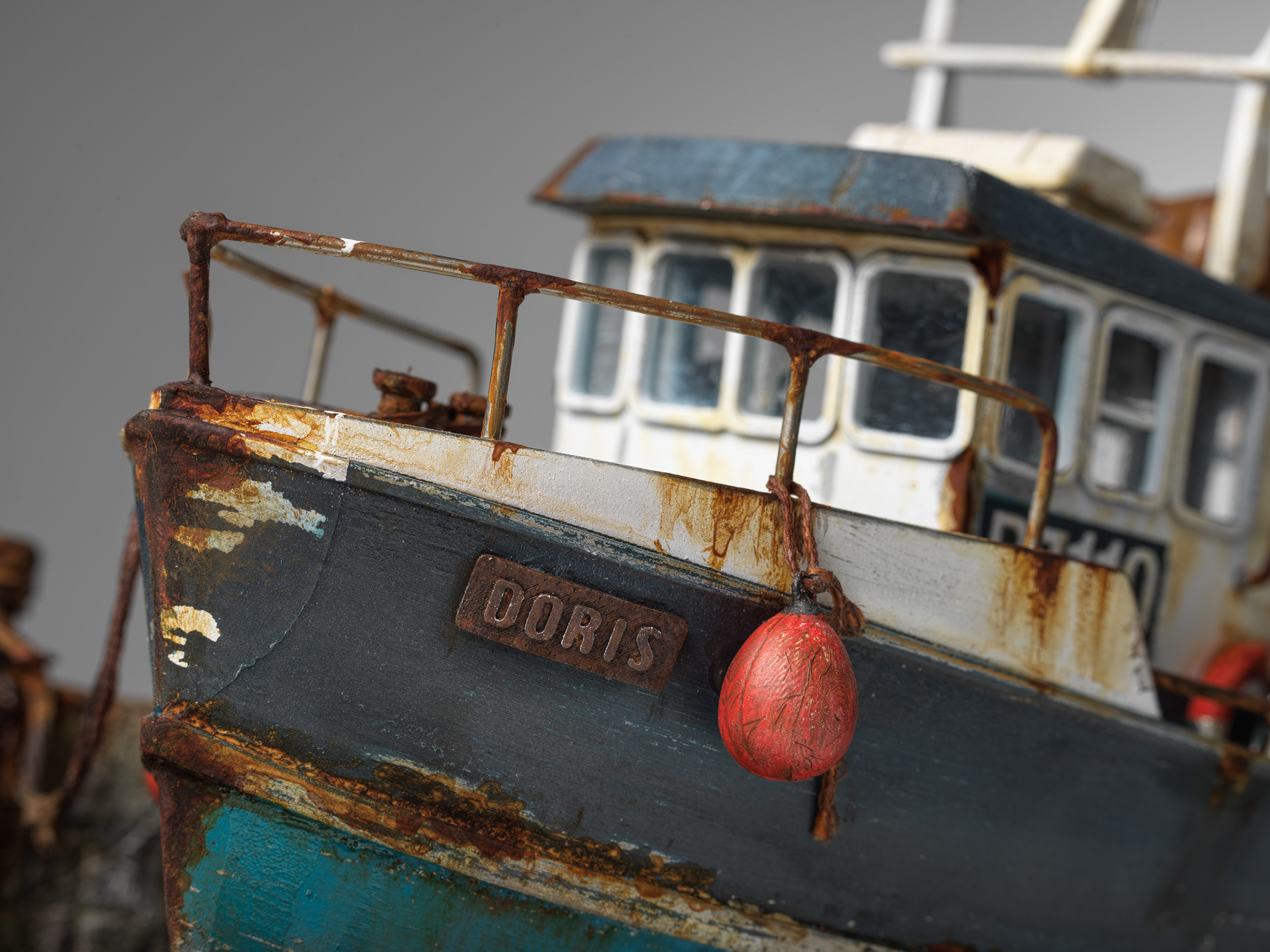 Close view of Doris's nameplate, red fender and weathered bow