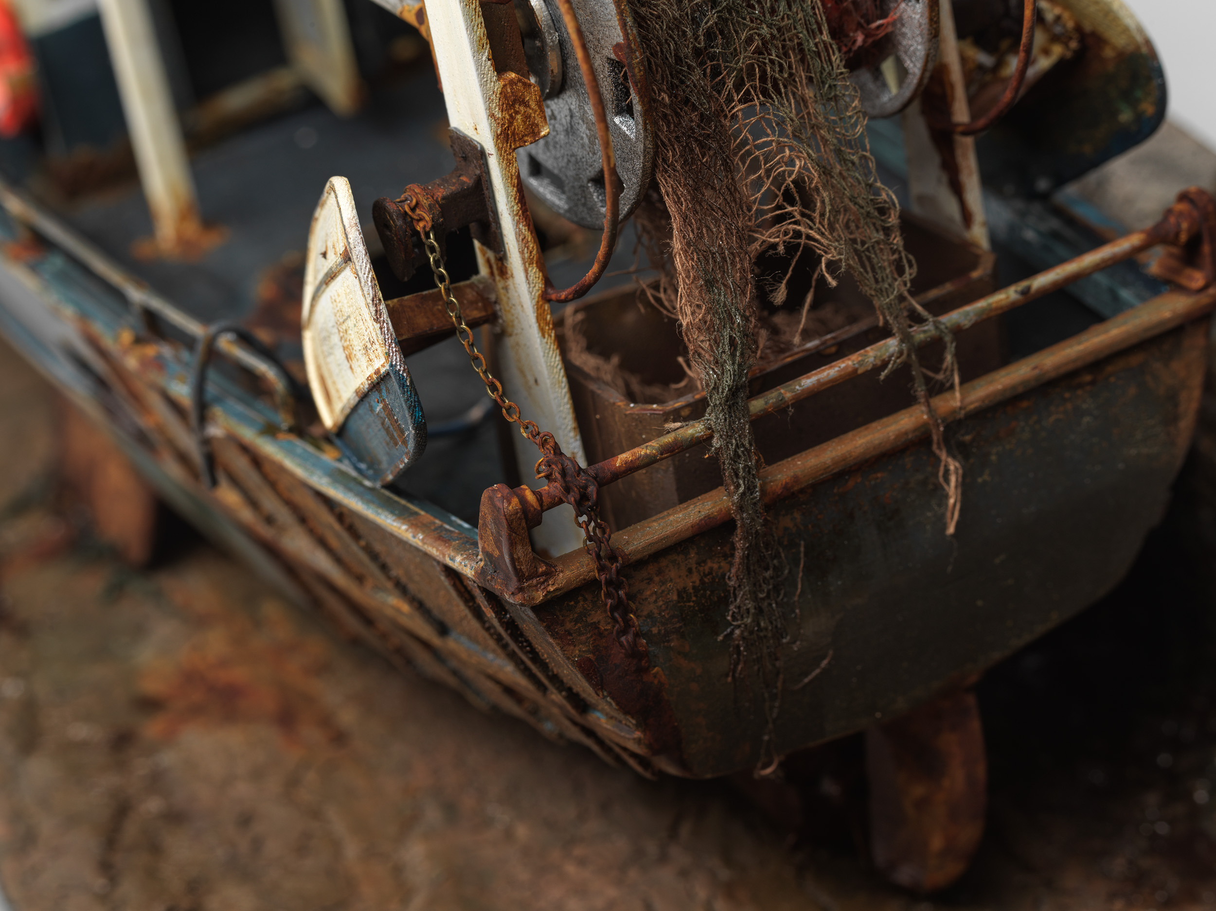 Detail of the fishing nets, chain, trawl gear and corroded stern railings
